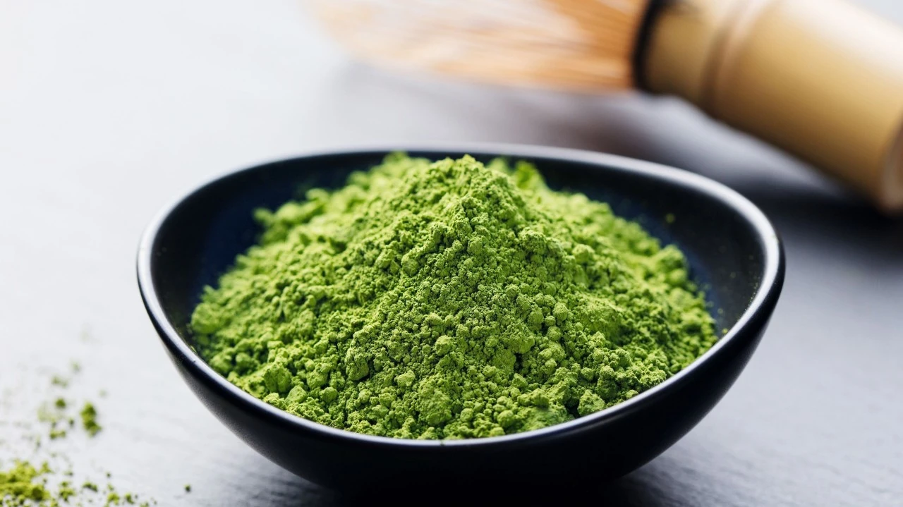 Matcha powder in a dark bowl.