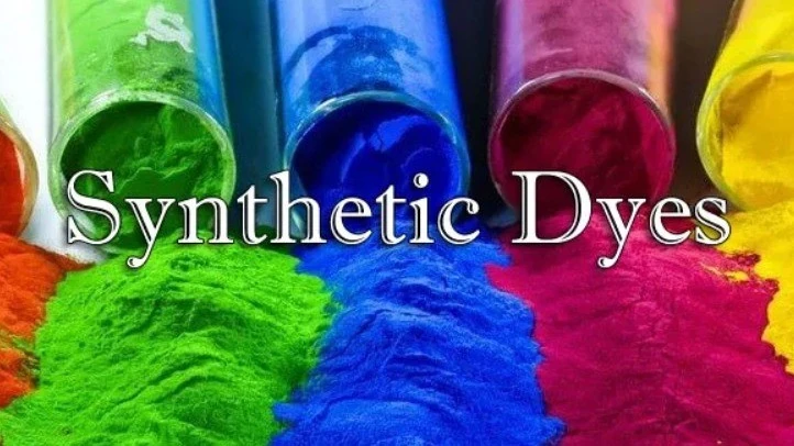 Colored powders and paint-like pigments with the words Synthetic Dyes.